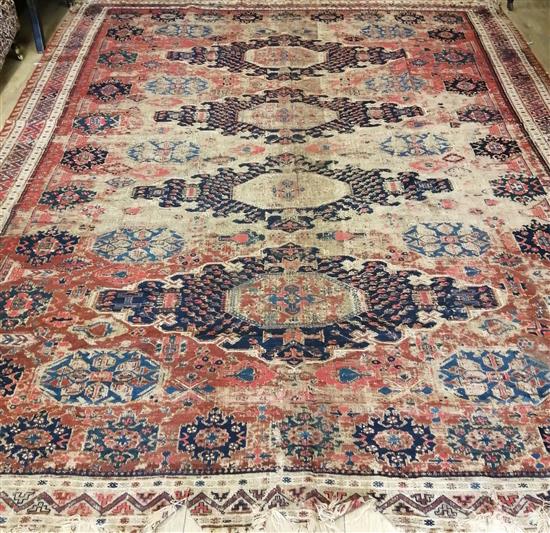 A Bokhara red ground carpet, (badly worn) 330 x 270cm